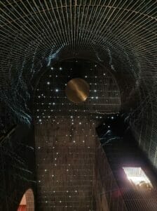 View from below of tiled wet room fibre optic star ceiling